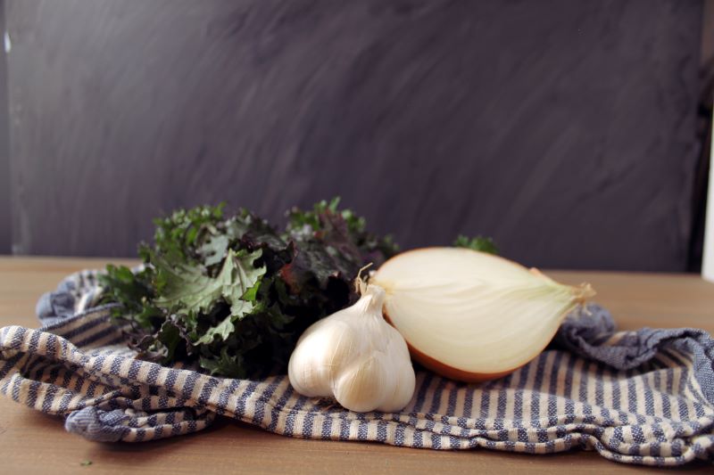 Onion, kale and garlic for the quiche flavors