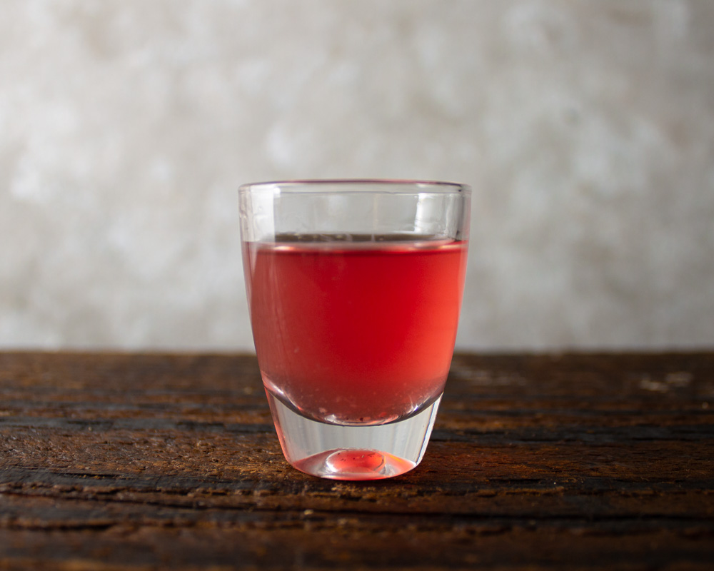 Pomegranate spice liqueur in glass