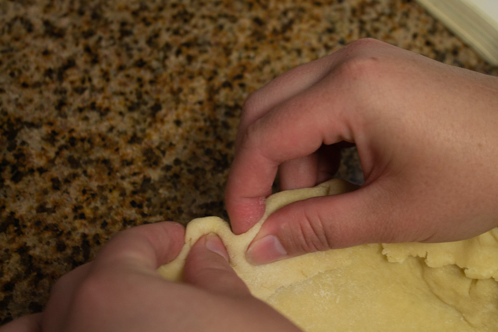 Crimping the edges of the pie