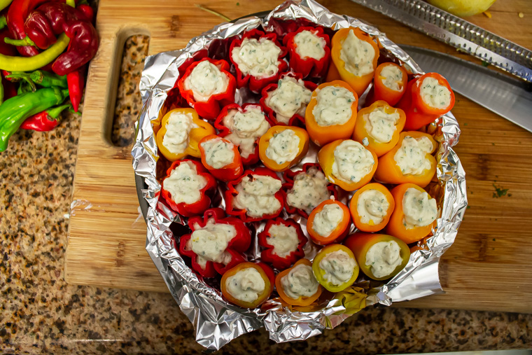 Stuffed peppers stacked in pan