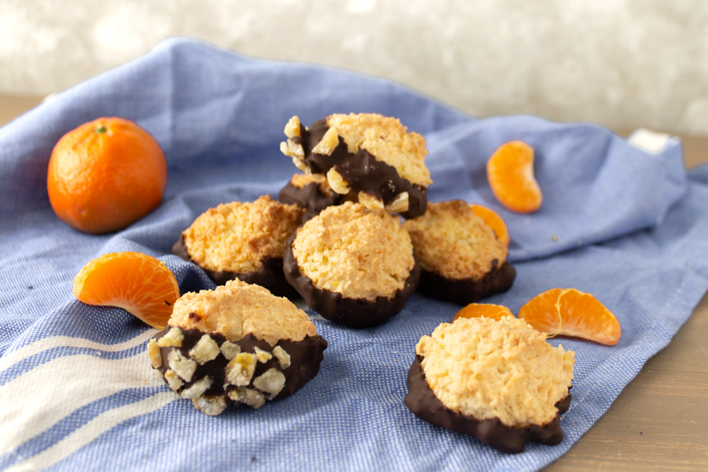 Orange coconut macaroons on a blue towel