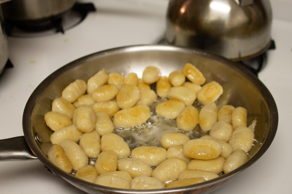 Gnocchi being pan fried