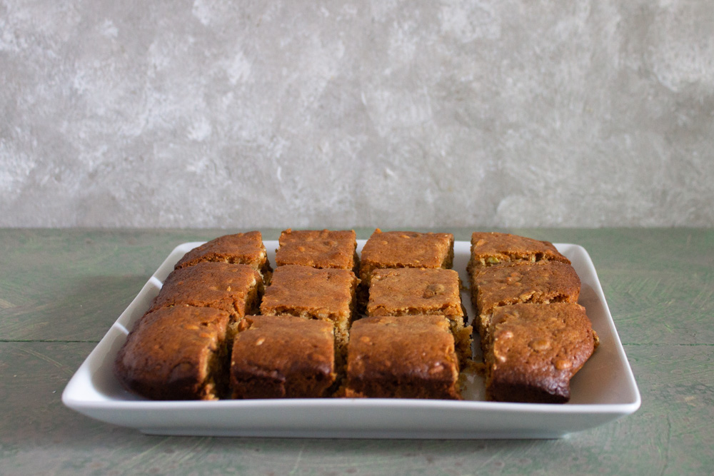 Cut baklava blondies on white plate