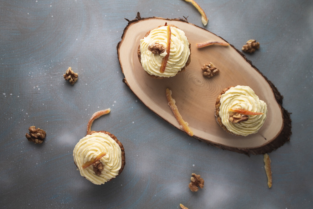 Top view of 3 carrot cupcakes with mascarpone frosting