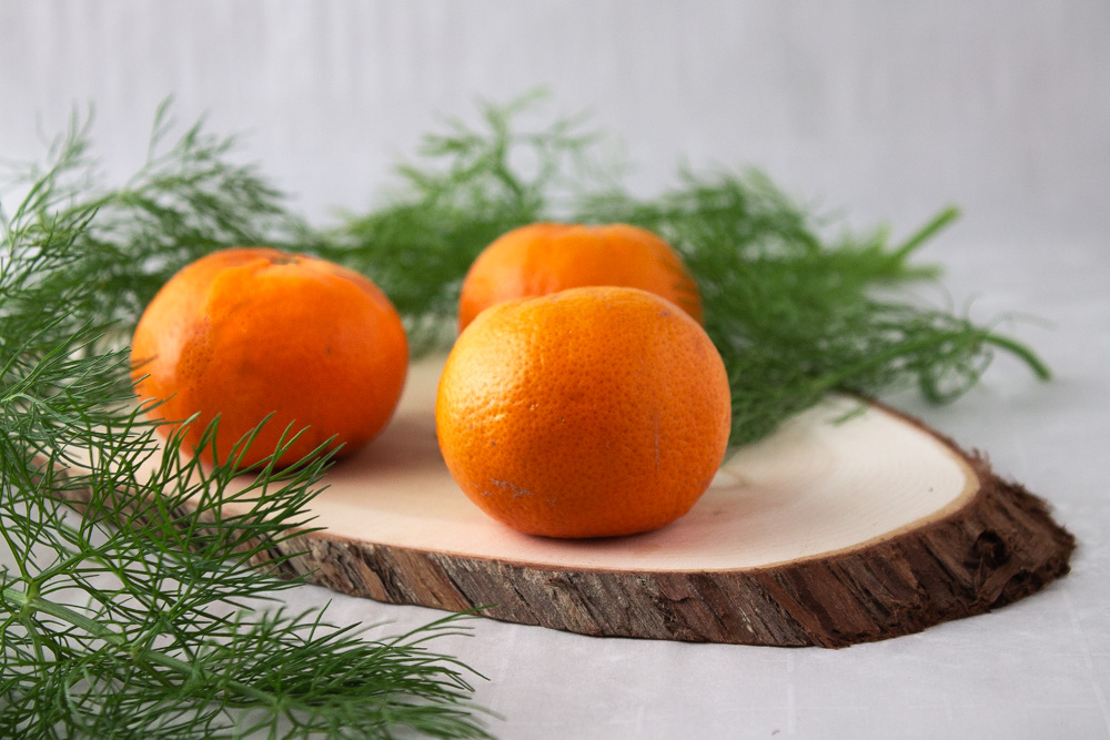 mandarins and fennel on wood