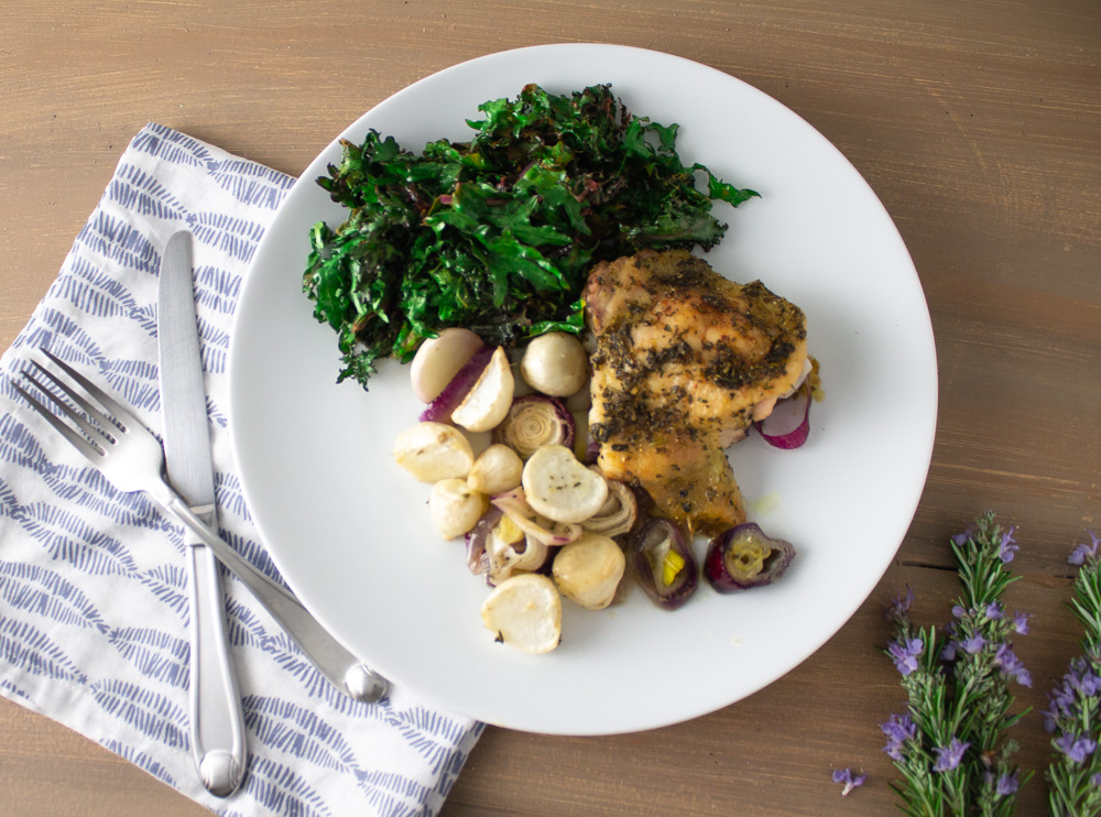 Overhead of herbed chicken and turnips