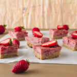 Strawberry bars on parchment side shot
