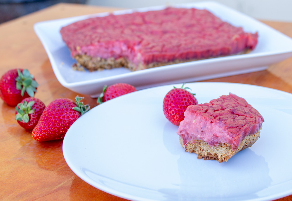 Overexposed picture of strawberry bars ona white plate