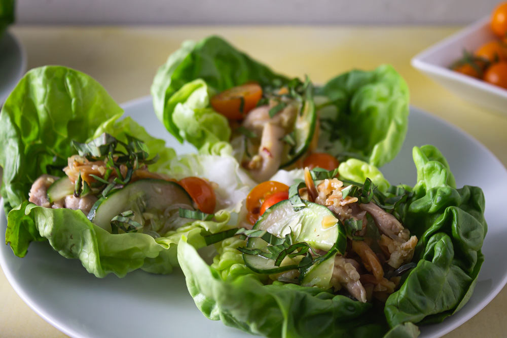Close up of 3 lettuce wraps on white plate