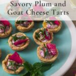Angled shot of plum goat cheese tarts on green plate with text