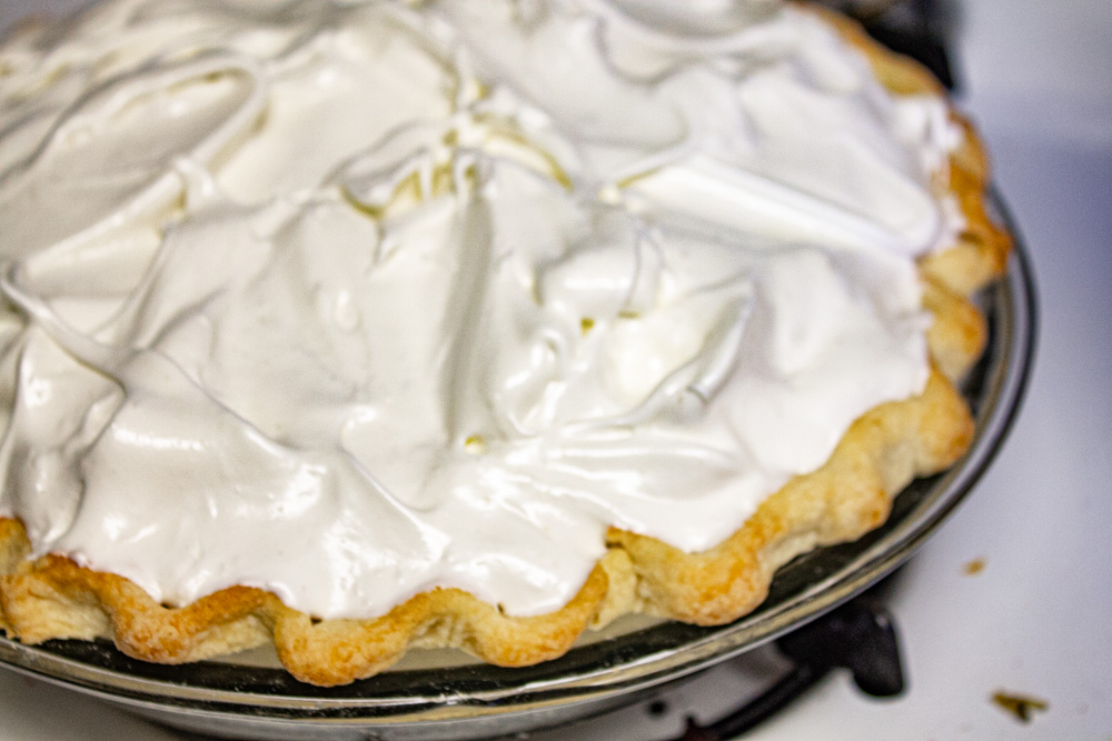 Stiff meringue on pie ready for oven