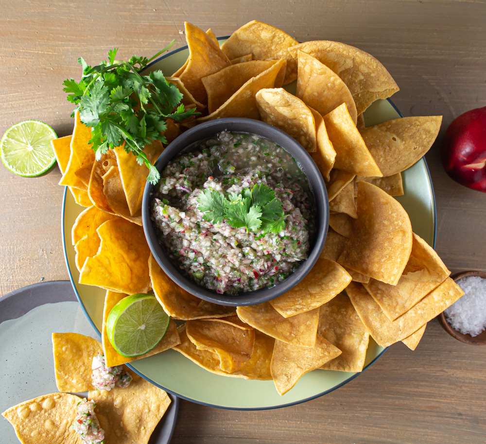 Top view white nectarine salsa with chips