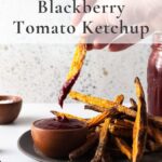 sweet potato fry dipping in blackberry ketchup