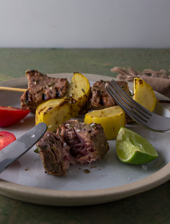 cut up marianated tuna and squash on plate