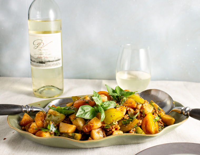 Tomato and canteloupe salad with a glass of white wine