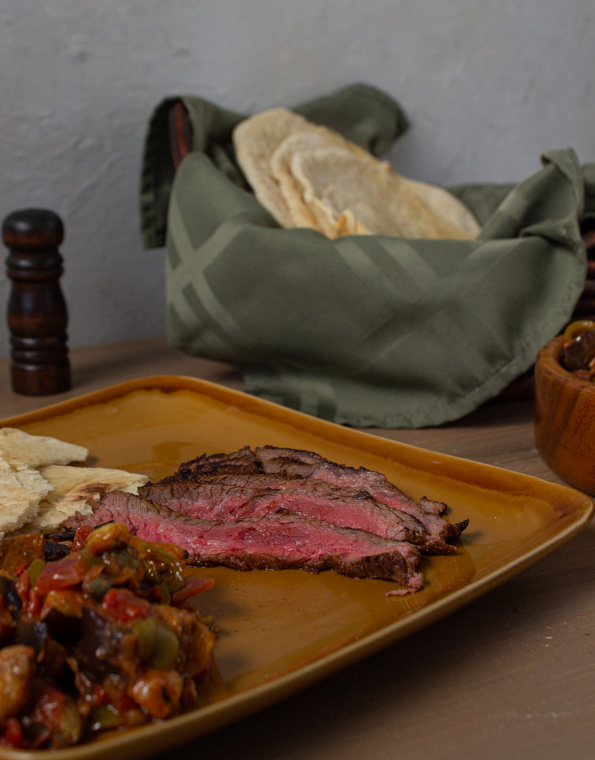 marinated steak with flatbread and caponata